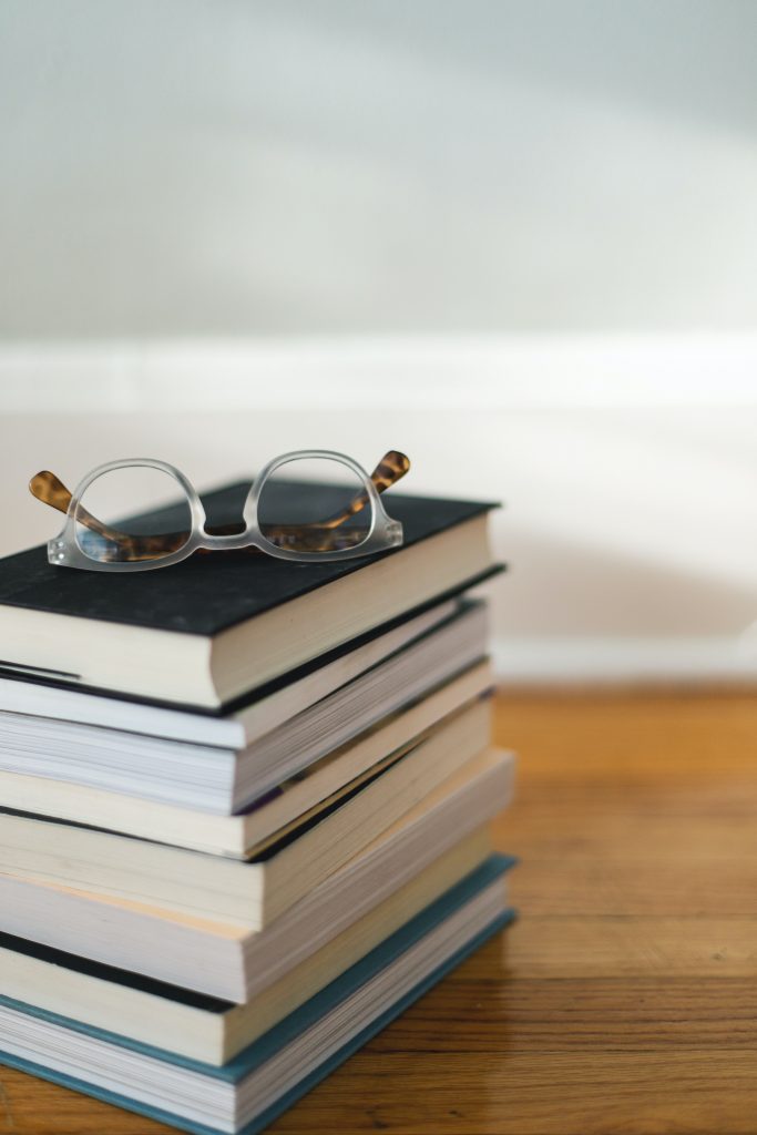 Book stack with glasses on top. Post for Our Favourite Books for 2021